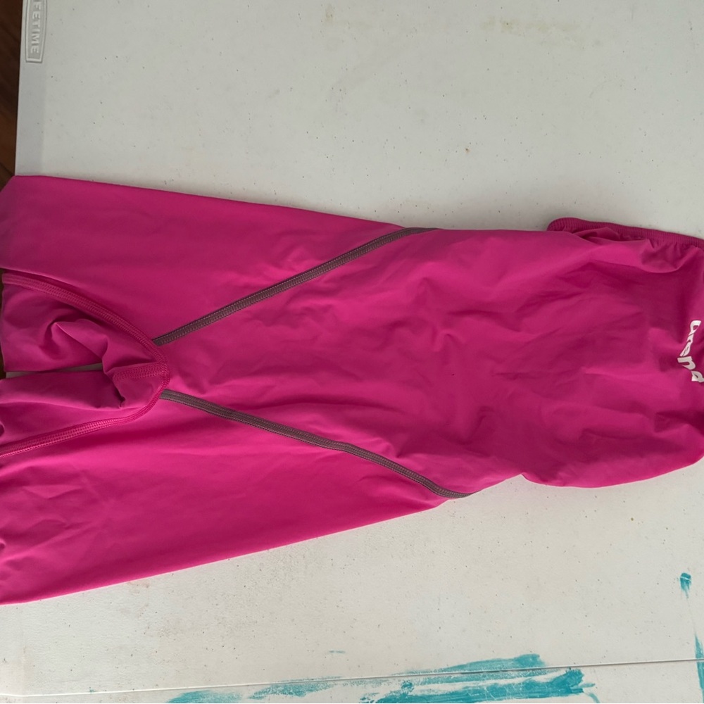 Arena Tech Suit. Hot Pink. Has One Thread that look like it’s unraveling. Size26
